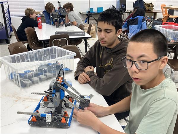 Students work on a robot.